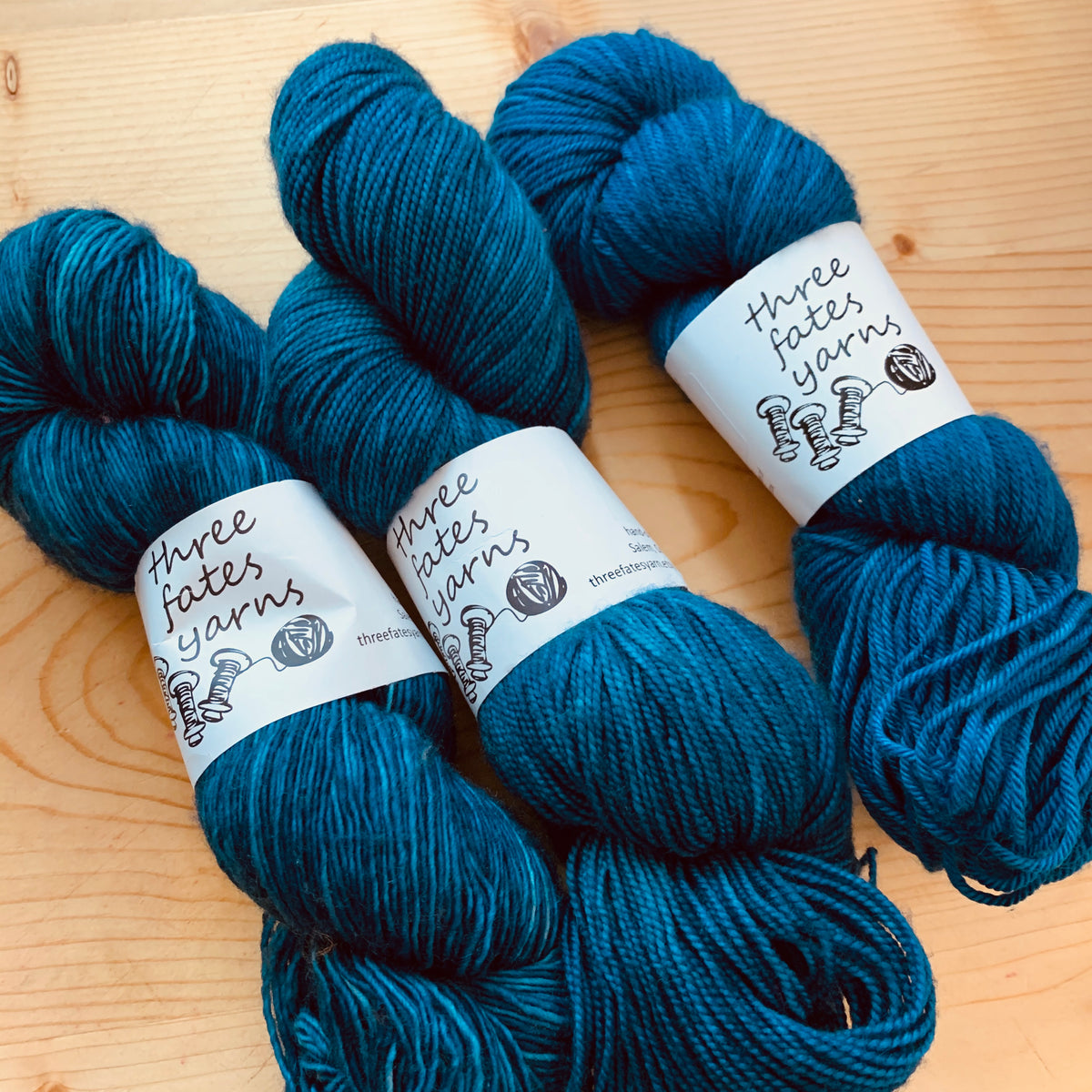 blue green knitting and crocheting yarn from three fates yarns