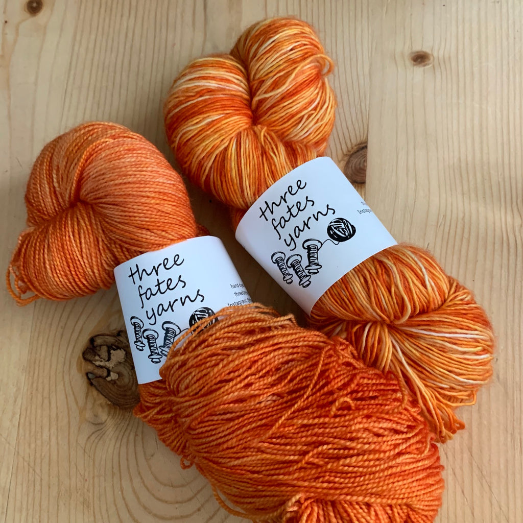 yellow-orange | orange plastic | yarn